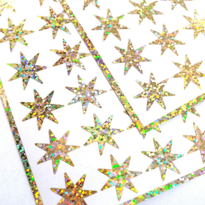 Gold Seven Point Starburst Stickers, set of 48 sparkly star stickers for ornaments, journals, planners, gift tags and craft projects.