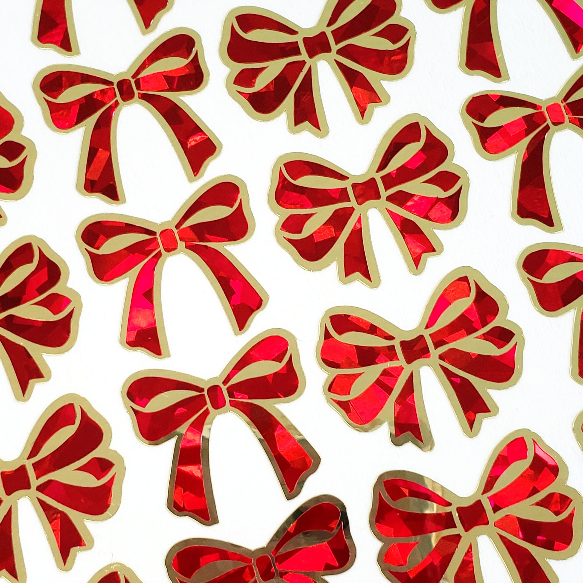 Christmas Bow Stickers, set of 28 red and gold festive ribbon shaped decals, peel and stick bows for holiday cards, ornaments and envelopes.