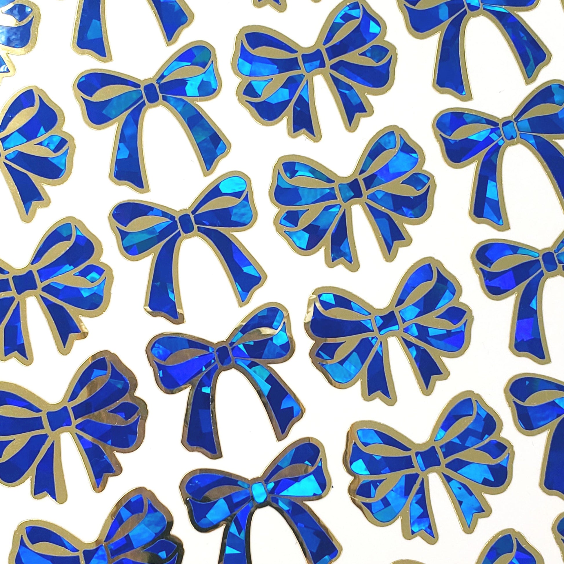 Holiday Bow Stickers, set of 28 blue and gold festive ribbon shaped decals, peel and stick bows for tags, cards, ornaments and envelopes.