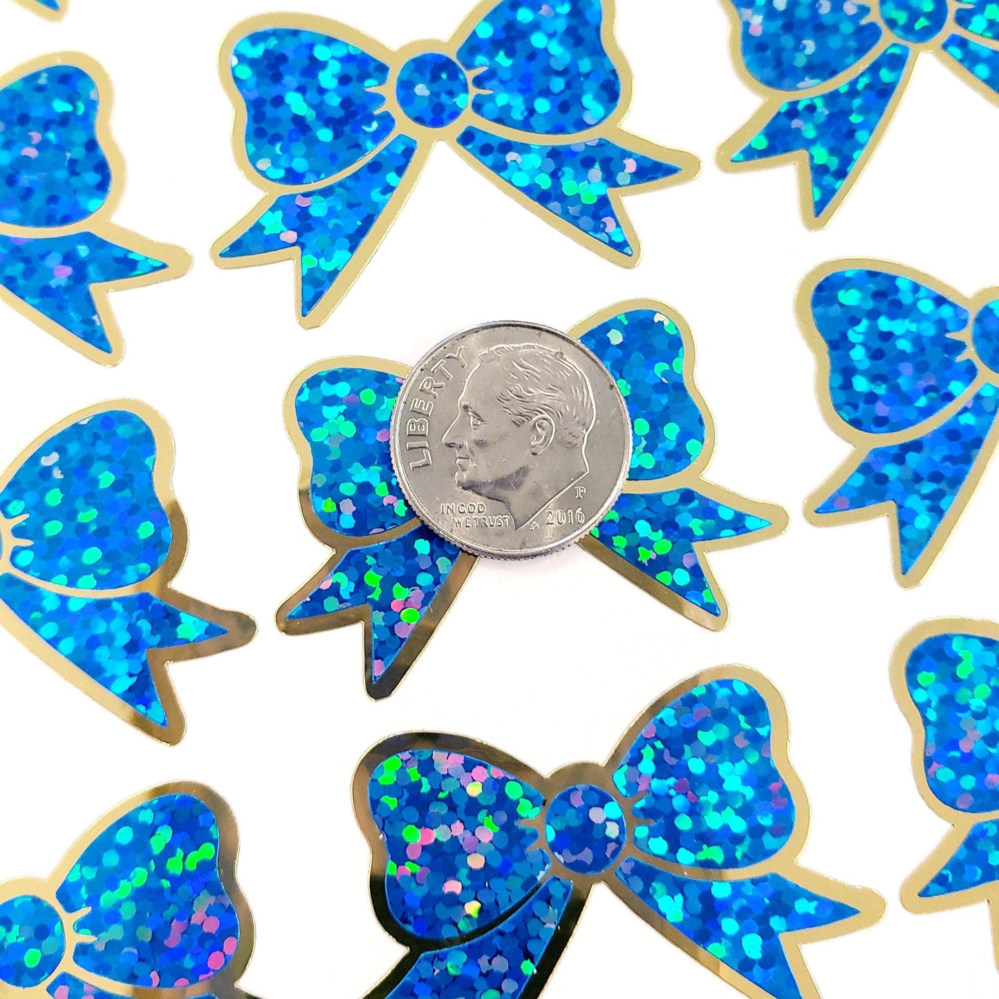 Blue Christmas Bow Stickers, set of 18 small sparkly ribbons for cards, journals, ornaments, laptops and craft projects, each 1.5 inches.