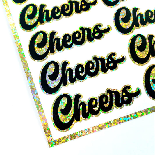 Cheers stickers for wine glasses, scrapbook pages, junk journals, or party invitation envelope seals. Black and gold sparkly labels.