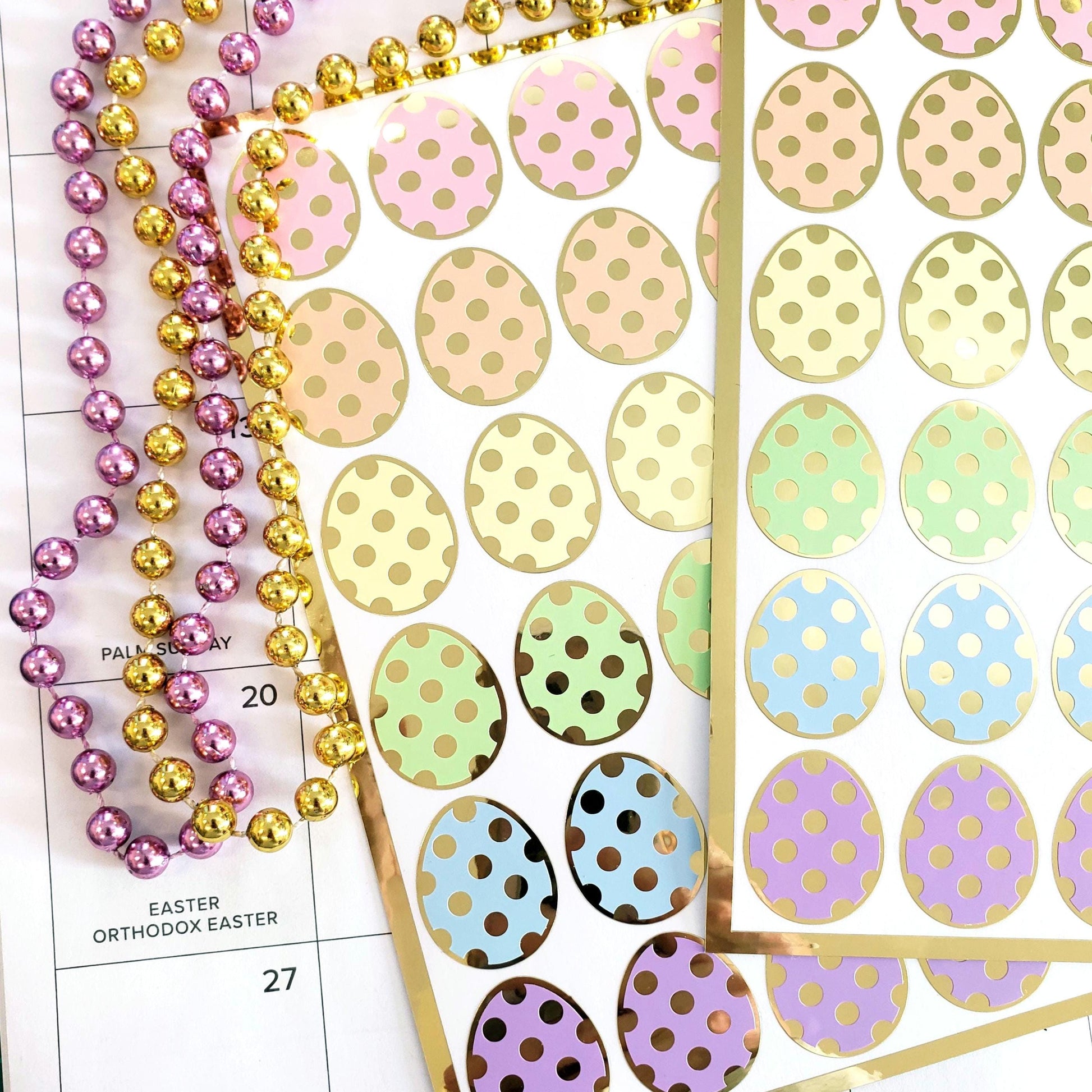 set of 30 pastel color easter egg stickers. Polka dot design with gold outline